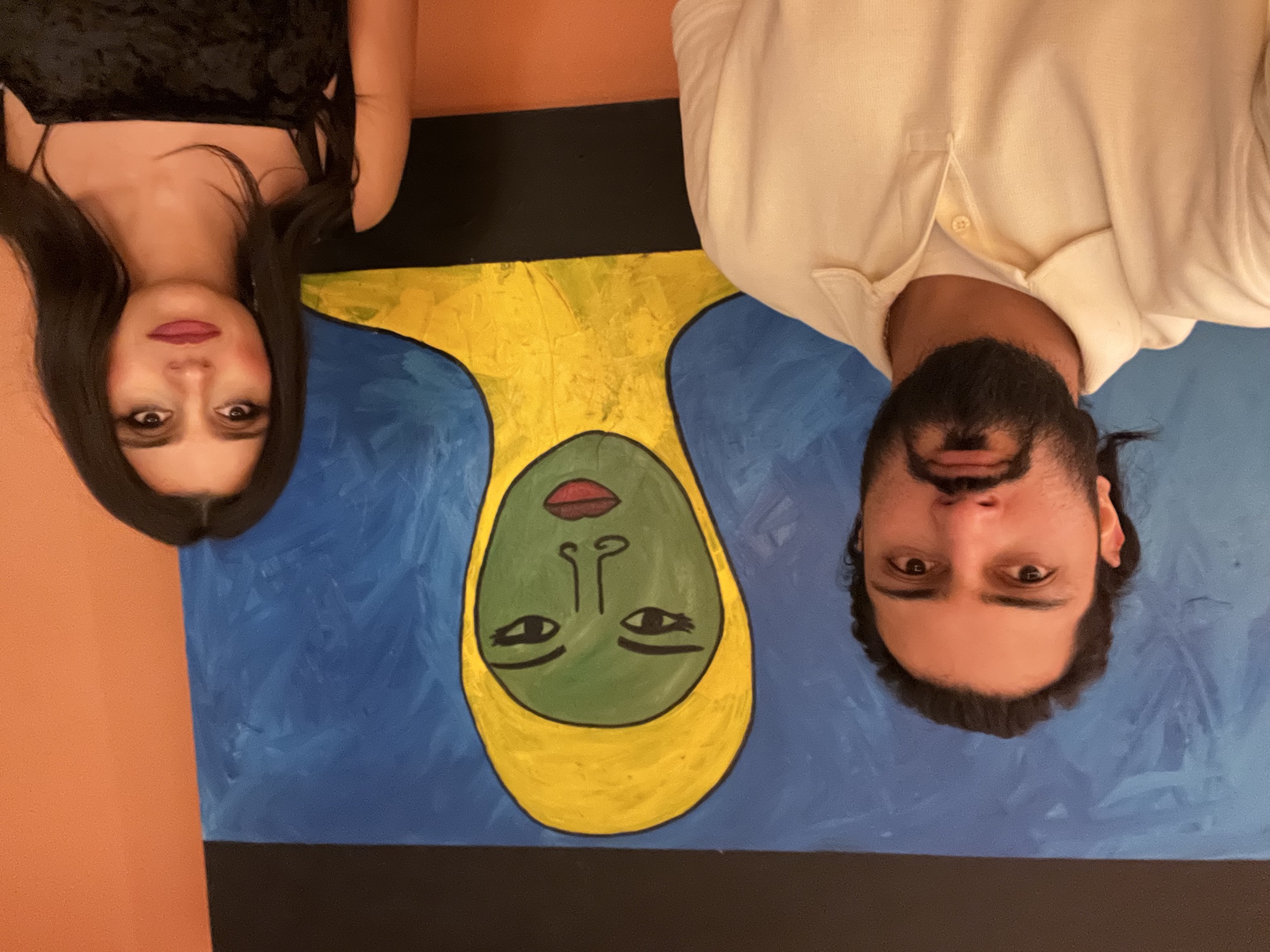 Jennifer and Samir in front of a painting