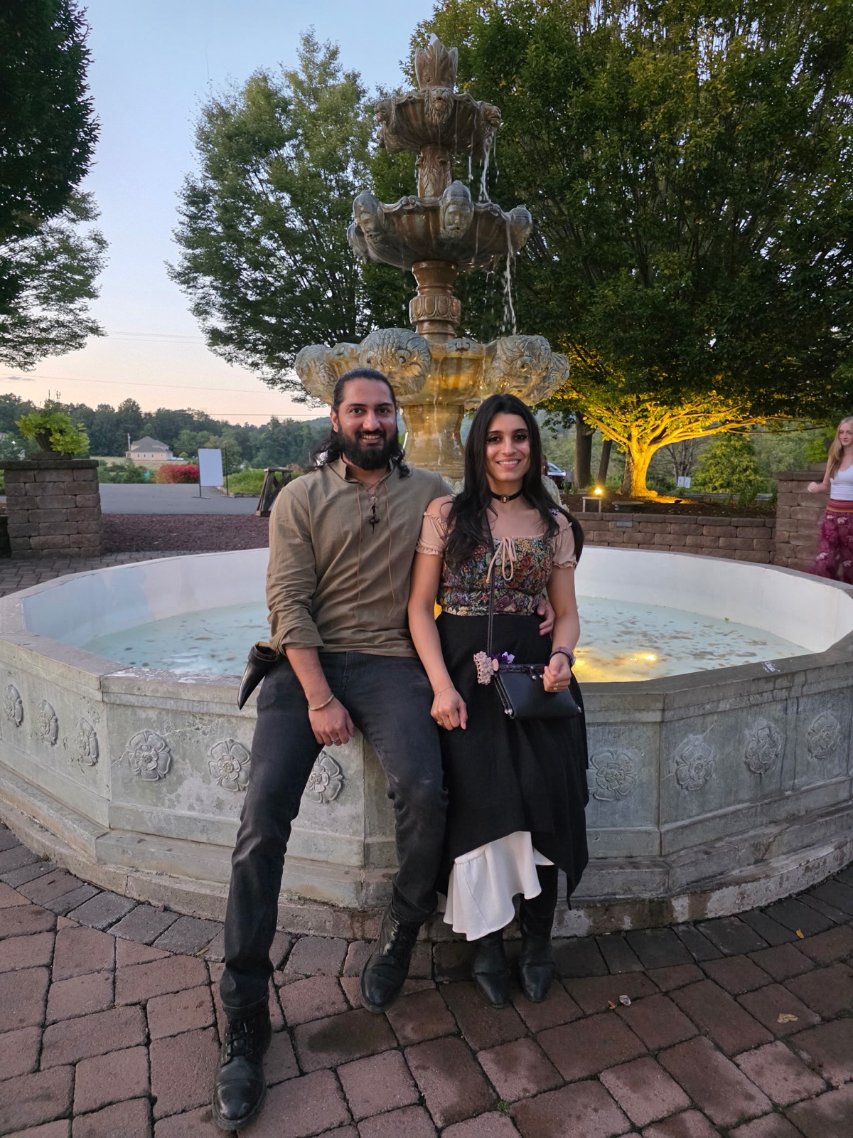 Jennifer and Samir by a fountain