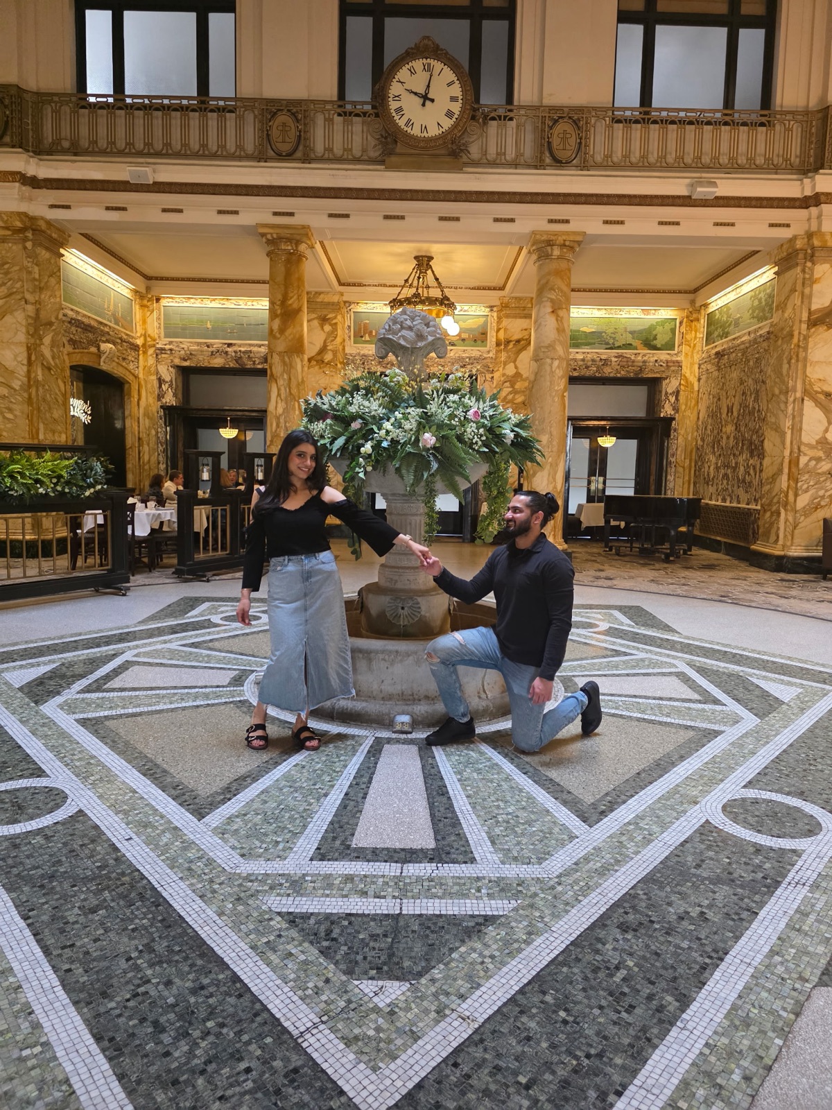Jennifer and Samir in a grand hotel lobby